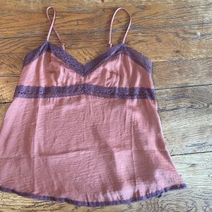 Rose sink top with purple lace trim.